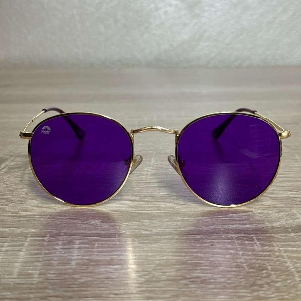 Rainbow OPTX Round sunglasses a gold metal frame and indigo purple lenses